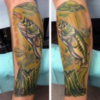 Realistic looking colorful little jumping fish tattoo on leg