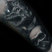 Realistic looking detailed arm tattoo of Egypt God with skull