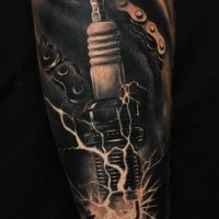 Realistic looking forearm tattoo of spark plug and chain