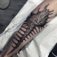 Realistic looking painted in dotwork style tattoo of creepy animal skeleton