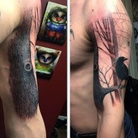 Realistic looking shoulder tattoo of big tree with crow