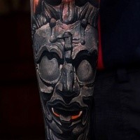 Realistic looking stonework style arm tattoo of ancient God statue