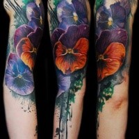 Realistic looking watercolor style shoulder tattoo of various flowers