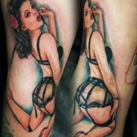 Realistic painted big colored seductive woman tattoo on arm