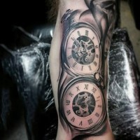 Realistic photo like black and white mechanic pocket clocks tattoo on arm