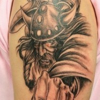 Realistic viking attack tattoo on shoulder