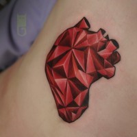 Red and black original design sharp human heart tattoo stylized with triangles