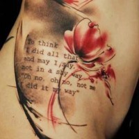 Red flowers tattoo on ribs by florian karg