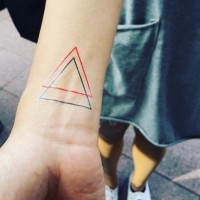 Red ink and black ink triangle thin line tattoo on wrist