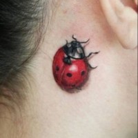 Red ladybug tattoo on neck