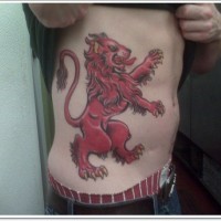 Red lion tattoo on ribs