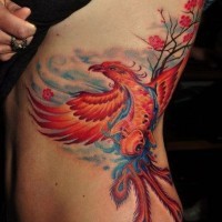 Red phoenix tattoo on ribs