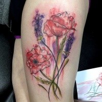 Red poppy and wild flowers colored thigh tattoo in watercolor style