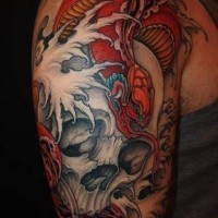 Red snake on skull in sea  tattoo on arm