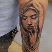 Religious catholic gray-ink Virgin Mary tattoo on forearm