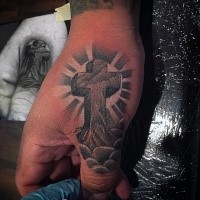 Religious massive old cross with cracks tattoo on hand and thumb