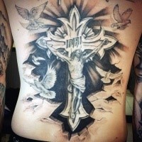 Religious style black and white back tattoo of Jesus on cross tattoo