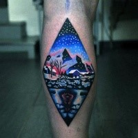 Rhombus shaped colored small leg tattoo stylized with nigh countryside
