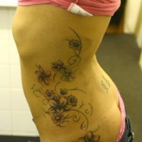 Ribs tattoo, designed plant, many different flowers