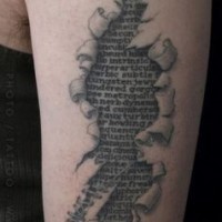 Ripped skin like black and white antic lettering tattoo on arm