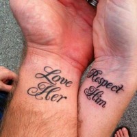 Romantic curled lettering wrist couple tattoo in dark black ink