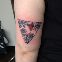 Roses and red rose inside triangle tattoo on shoulder