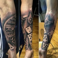 Roulette, cards and hand throwing dice gambling tattoo on arm