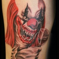 Scary clown with a glass of wine tattoo