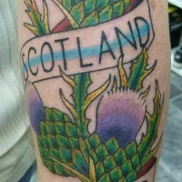 Schotland forever lettering with thistle scotland tattoo