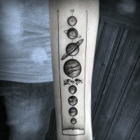 Scientific like black and white planet parade tattoo on arm