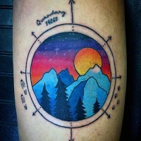 Scientific like multicolored night mountains with lettering tattoo on arm