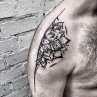 Separated black ink upper arm tattoo of big flower