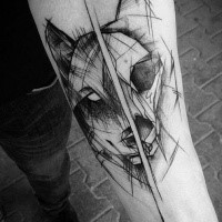 Separated designed by Inez Janiak forearm tattoo of wolf head with wolf skull