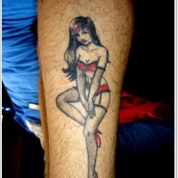 Sexy pin up girl in red bikini tattoo on arm