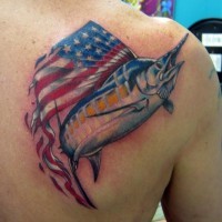 Shark with american flag tattoo on shoulder blade