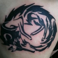 Sharp dark black ink tribal style curled wolf tattoo