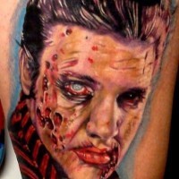 Sharp deigned and colored bloody zombie Elvis tattoo on thigh