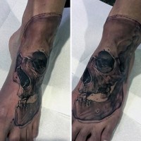 Sharp designed and painted black ink skull tattoo on foot