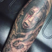 Sharp designed scary girl in mystical fog tattoo on arm