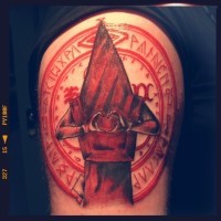 Sharp red colored big mystical shoulder tattoo of Silent Hill monster with cult circle