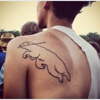 Silhouette bear floating tattoo on shoulder blade