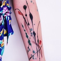 Simple abstract style colored tattoo on arm