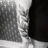 Simple black and white leaves tattoo on arm