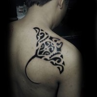 Simple black and white shoulder tattoo of black ink tribal ray