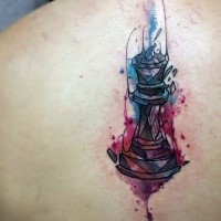 Simple black ink back tattoo of broken candlestick