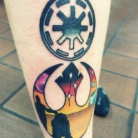 Simple black ink Empire emblem tattoo on leg with Rebel emblem