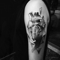 Simple black ink little astronaut tattoo on shoulder