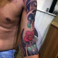 Simple cartoon like colored flower tattoo on arm