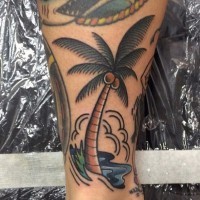 Simple colored little palm tree with coconuts tattoo on leg