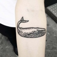 Simple design black and white medium size funny whale tattoo on forearm